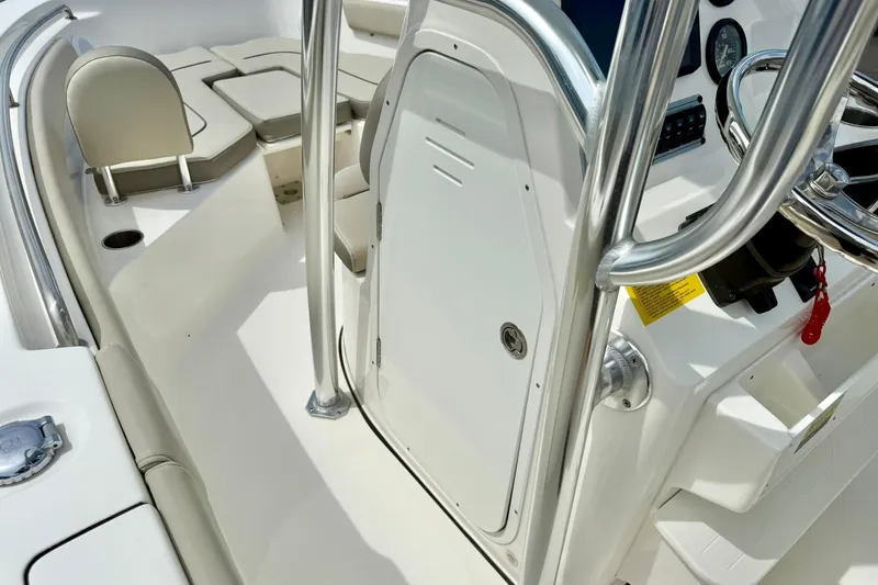 Slide: The Image of 2022 Key West 203 FS boat interior with steering console and seating area. - 18
