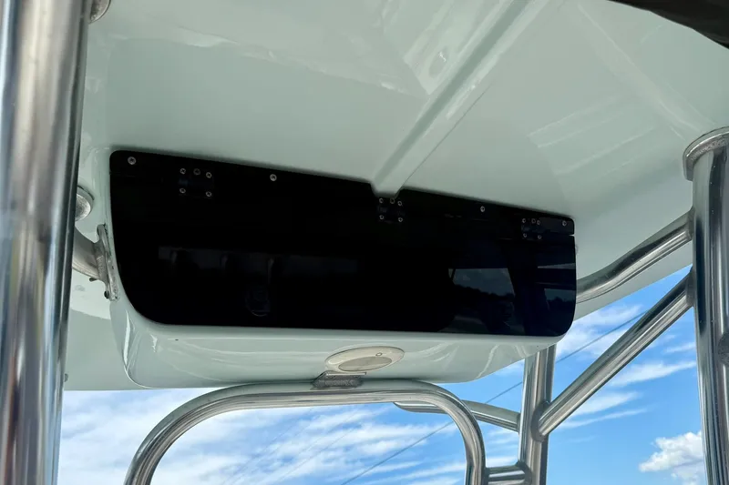 Slide: The Image of 2022 Key West 203 FS boat T-top with stainless steel frame against blue sky. - 20
