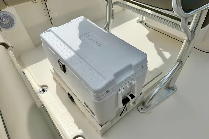 Slide: The Image of White cooler on 2022 Key West 203 FS boat deck, near seating and metal frame. - 25