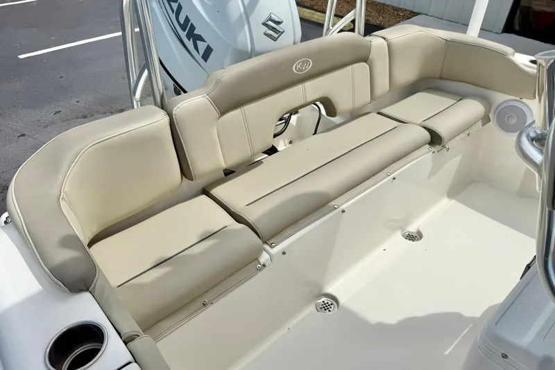 Slide: The Image of 2022 Key West 203 FS boat with beige seating and Suzuki engine. - 27