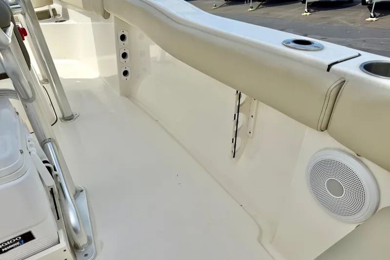 Slide: The Image of 2022 Key West 203 FS boat interior with seating, speaker, and rod holders. - 31