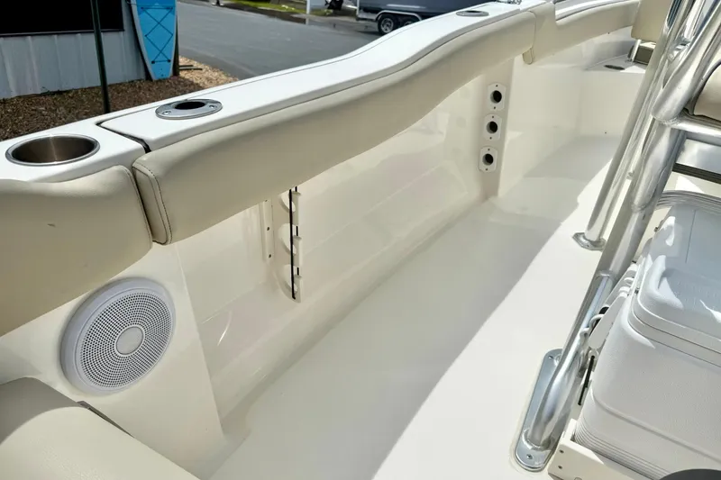 Slide: The Image of 2022 Key West 203 FS boat interior with seating, cup holders, and speaker. - 32