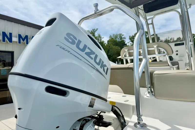 Slide: The Image of 2022 Key West 203 FS boat with Suzuki four-stroke engine, outdoor setting. - 33
