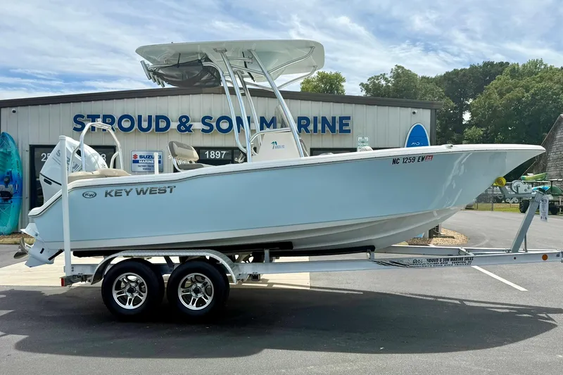Slide: The Image of 2022 Key West 203 FS boat on trailer at Stroud & Son Marine dealership. - 7