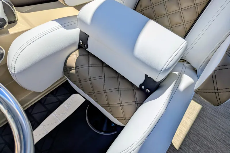 Slide: The Image of Luxurious seating on 2026 Trifecta 23RFSS boat with quilted design and white armrests. - 12