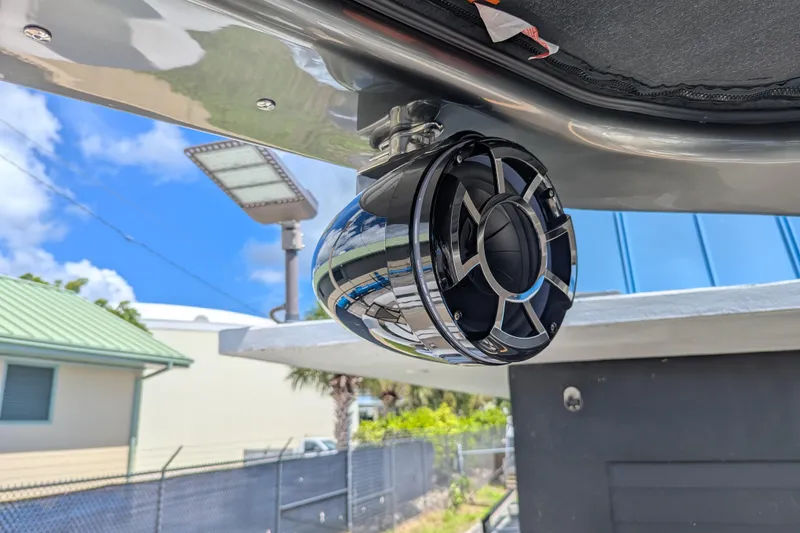 Slide: The Image of Outdoor speaker on a 2026 Trifecta 23RFSS boat, under a clear blue sky. - 18