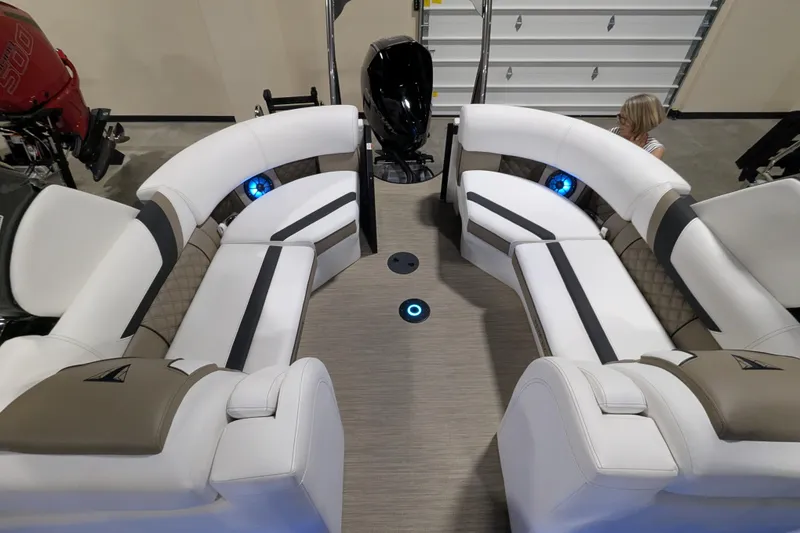 Slide: The Image of Luxurious interior of 2026 Trifecta 23RFSS pontoon boat with plush seating and ambient lighting. - 21