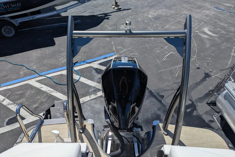 Slide: The Image of 2026 Trifecta 23RFSS boat with Mercury outboard motor, viewed from above. - 23