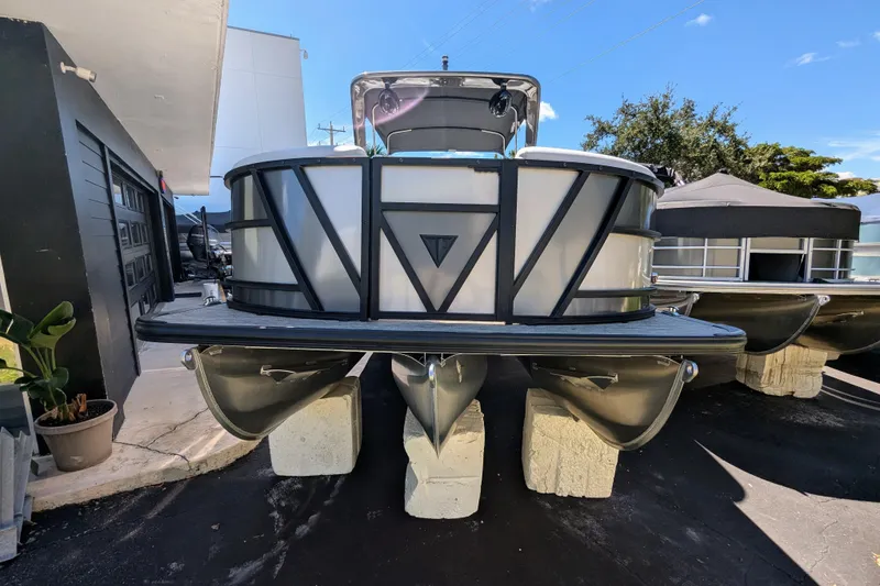 Slide: The Image of 2026 Trifecta 23RFSS pontoon boat displayed on concrete blocks outdoors. - 3