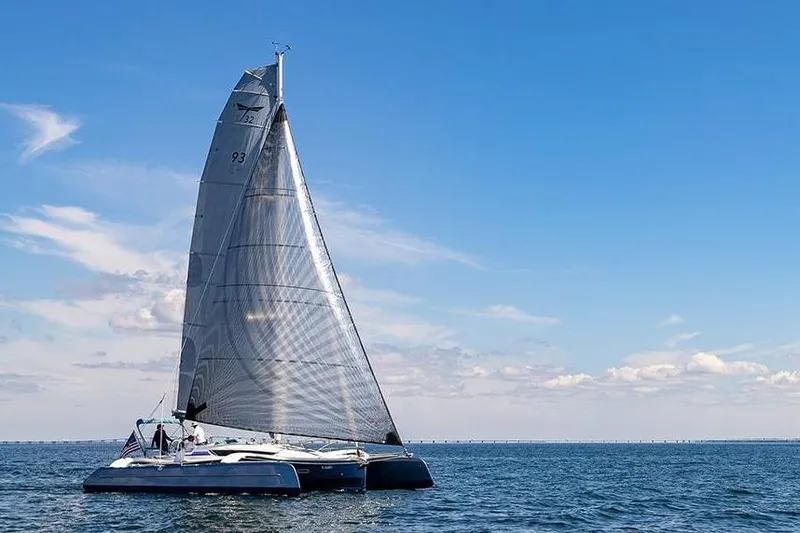The Image of Sailing on open sea, Dragonfly 32 Evolution 2025 under clear blue sky. - 0