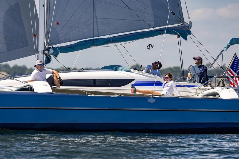 Slide: The Image of Sailing on a 2025 Dragonfly 32 Evolution yacht with crew enjoying the sunny day. - 12