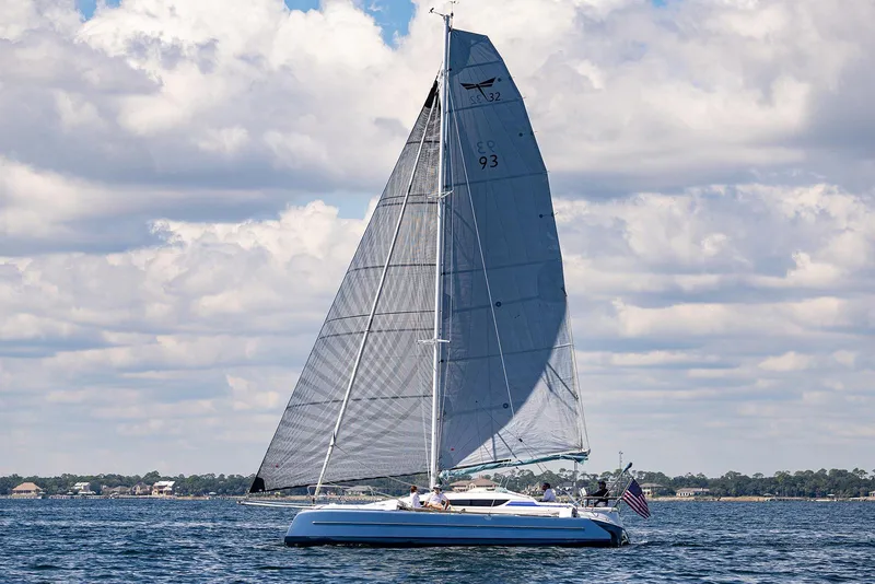 Slide: The Image of Sailing yacht Dragonfly 32 Evolution 2025 on open water under a cloudy sky. - 31