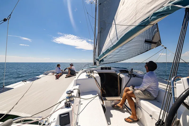 Slide: The Image of Sailing on Dragonfly 32 Evolution, 2025 model, with clear skies and calm sea. - 36