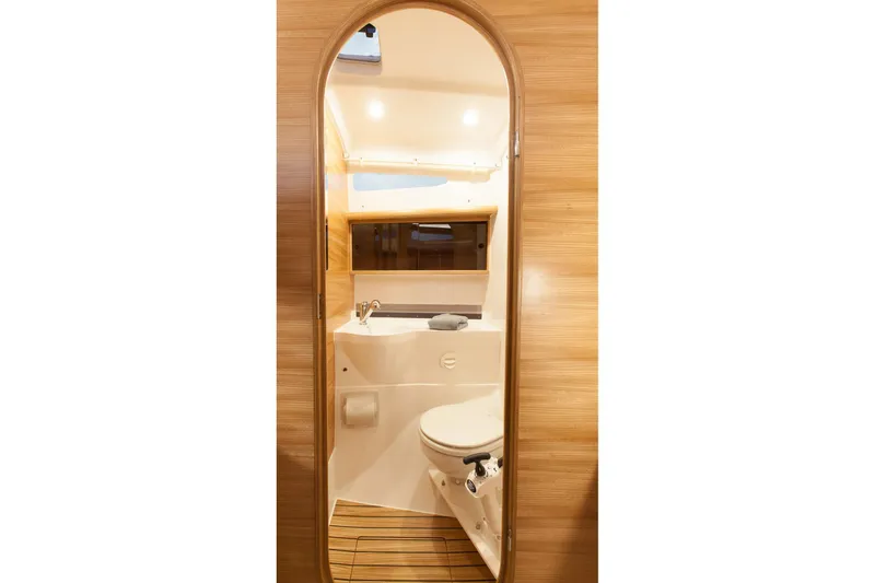 Slide: The Image of Modern bathroom interior of 2025 Dragonfly 32 Evolution yacht, featuring sleek wood paneling. - 41
