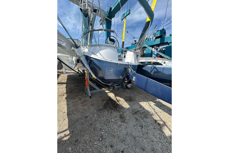 Slide: The Image of 2025 Dragonfly 32 Evolution sailboat on dry dock, blue hull, sunny day. - 47