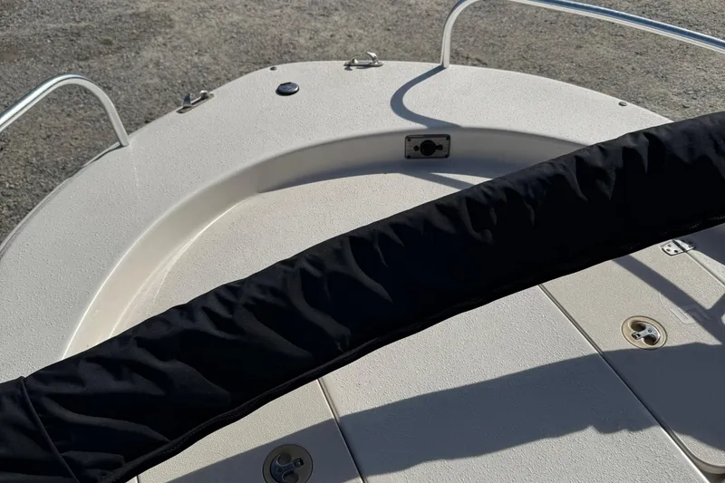 Slide: The Image of 2018 Carolina Skiff 16 JVX CC boat deck with railing and covered console. - 11