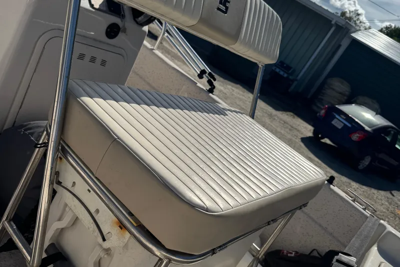 Slide: The Image of 2018 Carolina Skiff 16 JVX CC boat seat with stainless steel frame in outdoor setting. - 7