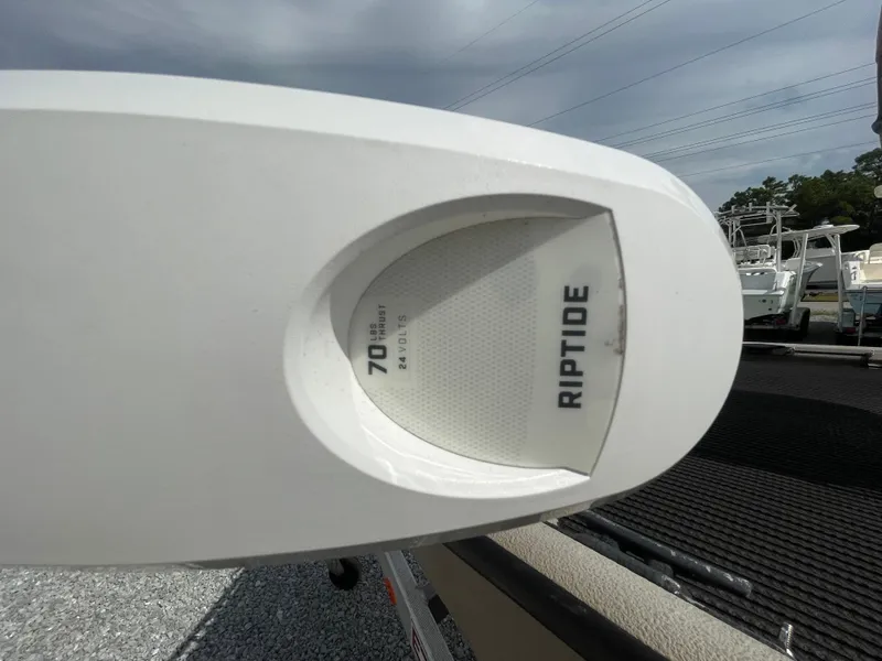 Slide: The Image of Close-up of a Riptide motor on a 2019 Excel 1860 Stalker SC boat. - 11