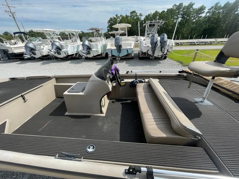 Slide: The Image of 2019 Excel 1860 Stalker SC boat interior with seating and steering console. - 12