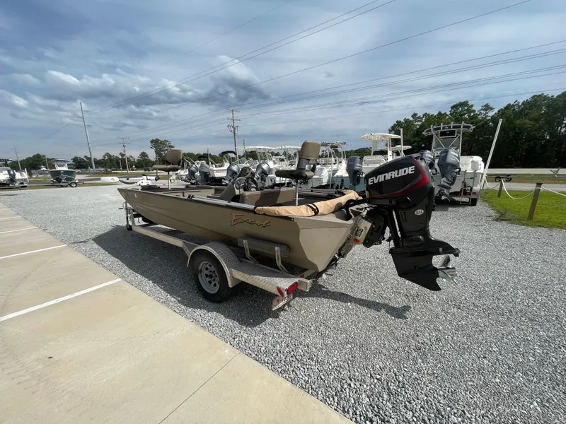 Slide: The Image of 2019 Excel 1860 Stalker SC boat with Evinrude motor on trailer in parking lot. - 6