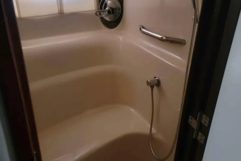 Slide: The Image of Shower area in 2007 Sea Ray 440 Sundancer yacht with handheld showerhead and grab bar. - 13