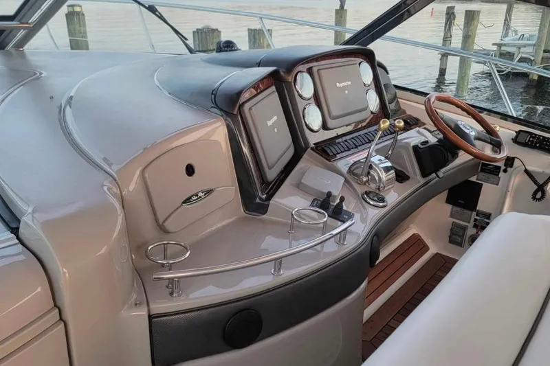 Slide: The Image of Helm of 2007 Sea Ray 440 Sundancer with modern controls and wood accents. - 3