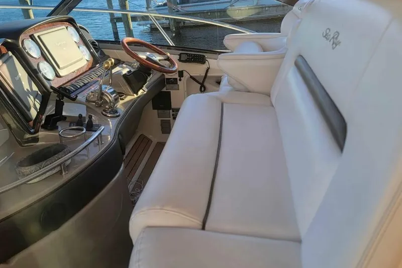 Slide: The Image of Luxurious interior of 2007 Sea Ray 440 Sundancer yacht with plush seating and modern controls. - 4