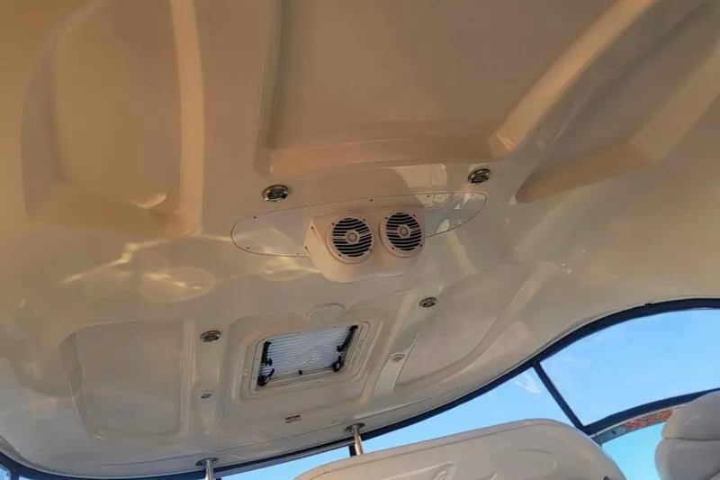 Slide: The Image of Ceiling view of 2007 Sea Ray 440 Sundancer boat with speakers and hatch. - 6