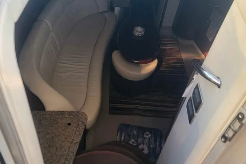 Slide: The Image of Interior of 2007 Sea Ray 440 Sundancer with beige seating and modern decor. - 8