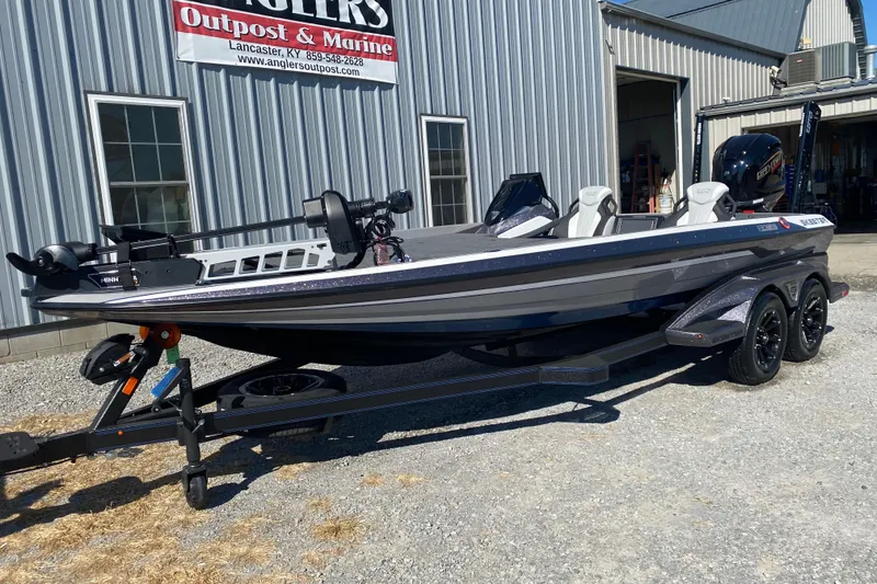 Slide: The Image of 2026 Skeeter FXR21 FLEX boat on trailer outside Anglers Outpost & Marine. - 3