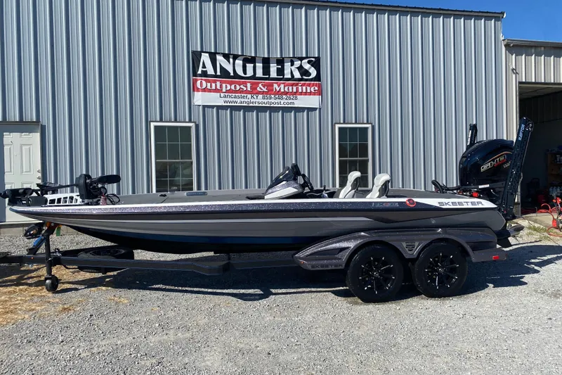 Slide: The Image of 2026 Skeeter FXR21 FLEX boat dashboard with steering wheel and touchscreen display. - 9