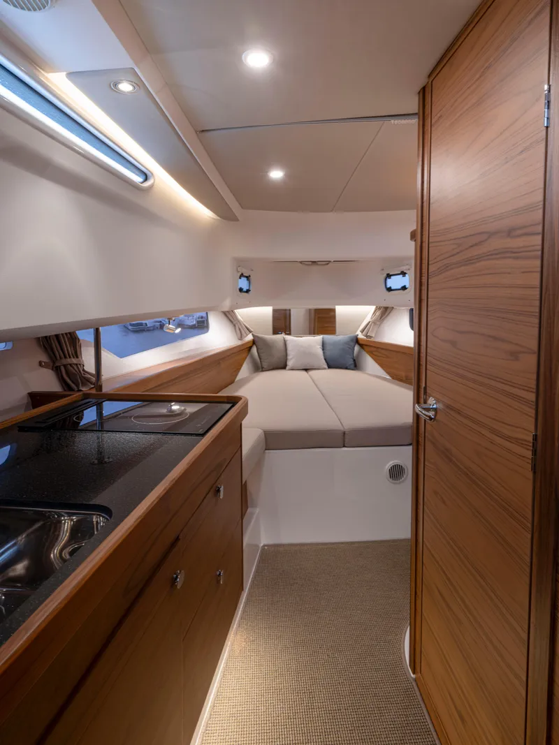Slide: The Image of Interior of 2026 Nimbus Commuter 11 boat with cozy cabin and modern amenities. - 9