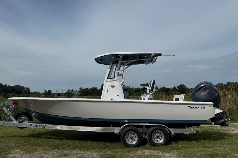 Slide: The Image of 2026 Tidewater 2410 Bay Max boat on trailer, side view, outdoors. - 1