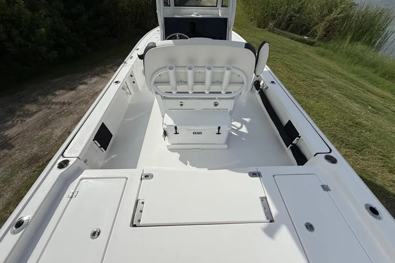 Slide: The Image of 2026 Tidewater 2410 Bay Max boat interior with seating and storage compartments. - 11