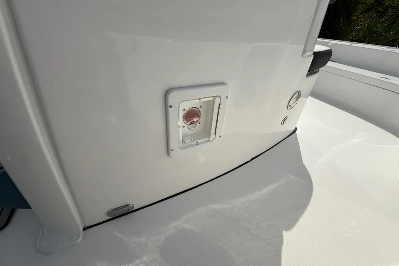 Slide: The Image of 2026 Tidewater 2410 Bay Max boat detail showing a white panel with a red switch. - 29