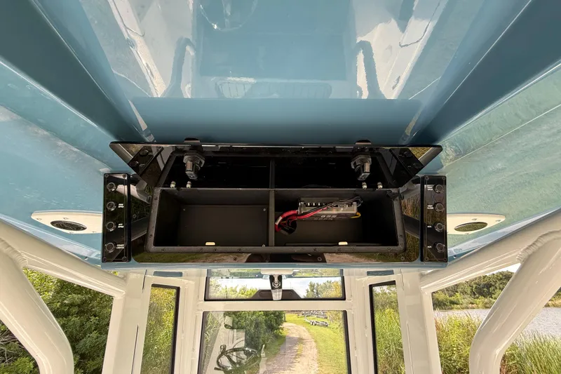 Slide: The Image of 2026 Tidewater 2410 Bay Max boat console with open storage compartment. - 31