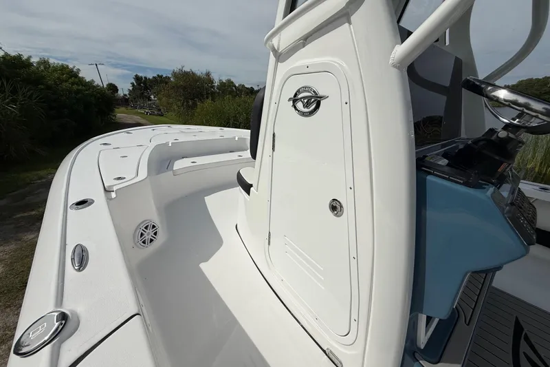 Slide: The Image of 2026 Tidewater 2410 Bay Max boat, white deck, sleek design, outdoor setting. - 32