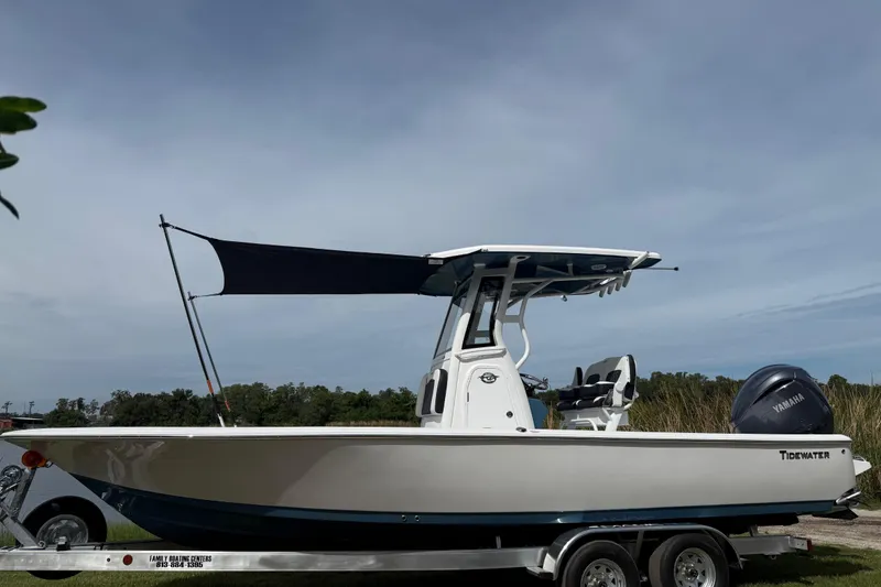 Slide: The Image of 2026 Tidewater 2410 Bay Max boat on trailer with Yamaha engine, outdoor setting. - 42