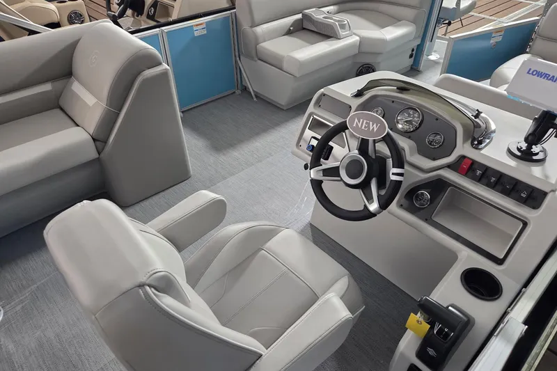 Slide: The Image of Interior of 2026 Godfrey Experience 2086 BFX boat with modern steering console and seating. - 3