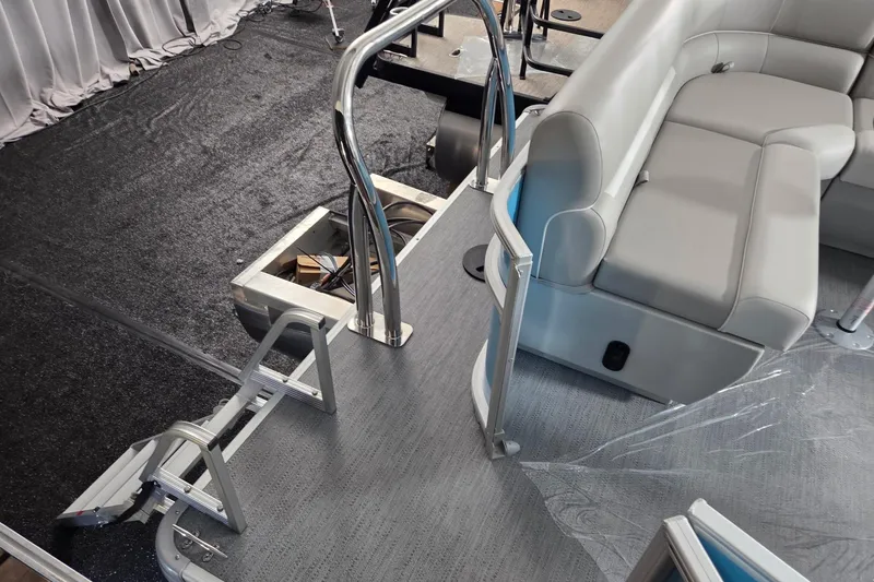 Slide: The Image of 2026 Godfrey Experience 2086 BFX pontoon boat interior with seating and ladder. - 7