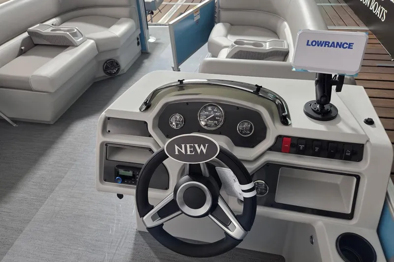 Slide: The Image of 2026 Godfrey Xperience 2086 BFX boat interior with steering wheel and Lowrance display. - 8