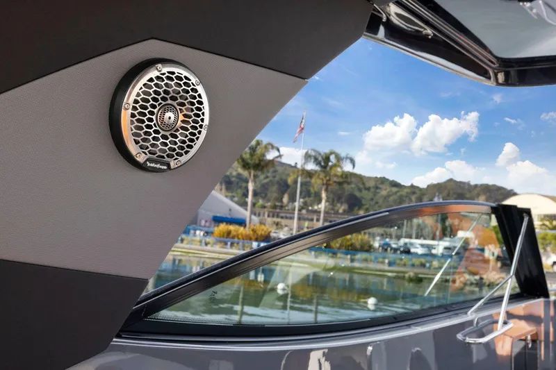 Slide: The Image of 2022 Cruisers Yachts 38 GLS South Beach IO with speaker, scenic marina view. - 24