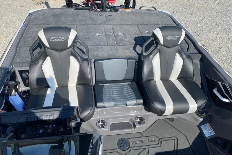 Slide: The Image of 2026 Skeeter FXR21 FLEX boat interior with dual black and white seats. - 14