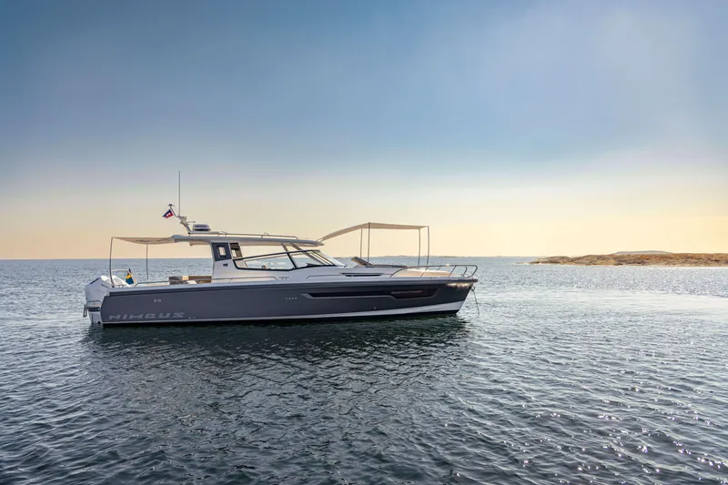 Slide: The Image of Nimbus Weekender 11, 2025 model, cruising on calm sea under clear sky. - 48