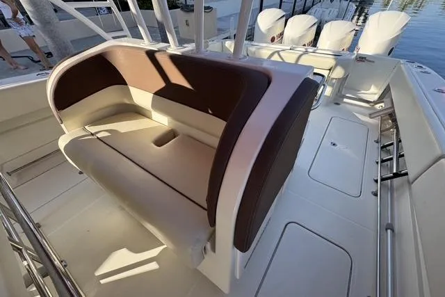 Slide: The Image of 2011 Hydra-Sports 4200 SF boat interior with cushioned seating and multiple outboard engines. - 14