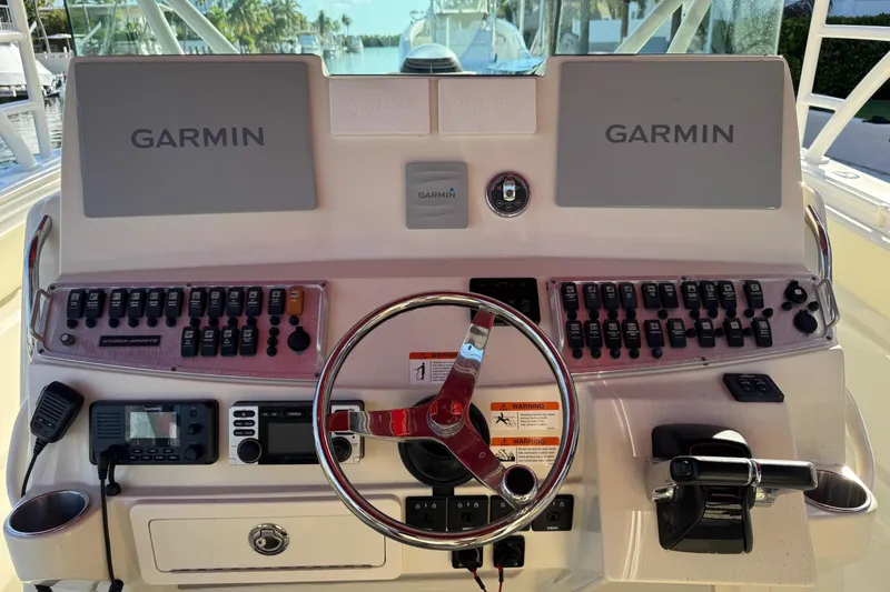 Slide: The Image of Control panel of a 2011 Hydra-Sports 4200 SF boat with Garmin displays. - 2