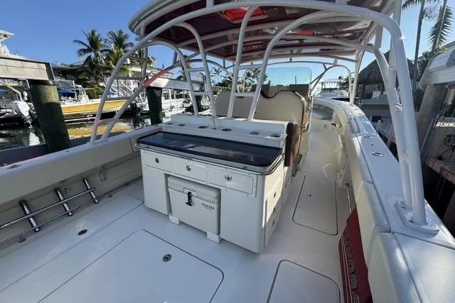 Slide: The Image of 2011 Hydra-Sports 4200 SF boat interior with seating and storage, docked at marina. - 7