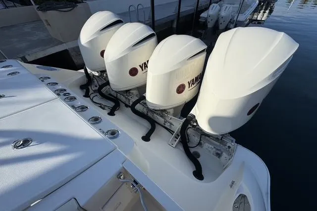 Slide: The Image of 2011 Hydra-Sports 4200 SF boat with four Yamaha outboard engines docked at marina. - 8