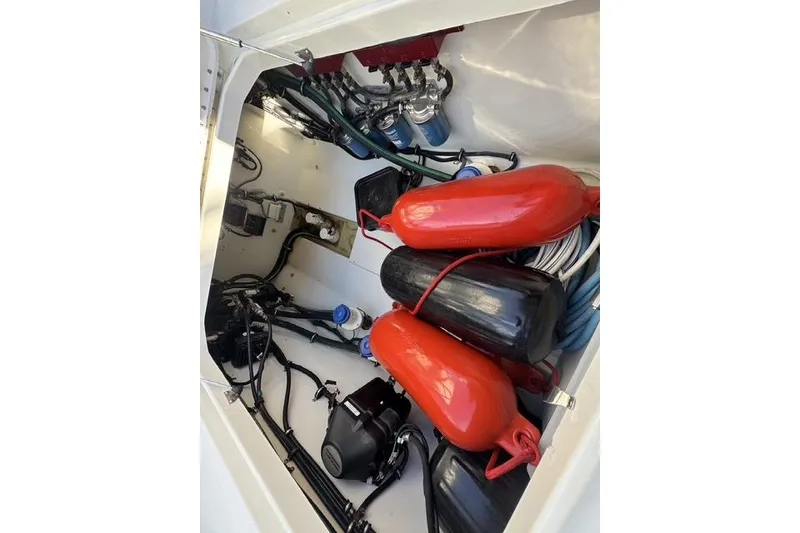 Slide: The Image of Interior view of a 2011 Hydra-Sports 4200 SF boat with equipment and fenders. - 9