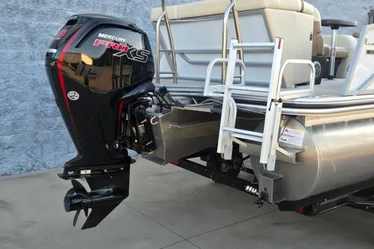 Slide: The Image of 2022 Lowe SS210 pontoon boat with Mercury Pro XS outboard motor, docked on concrete. - 13